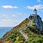 2023/01/neuseeland-kaka-point-ein-spazierpfad-fucc88hrt-bis-auf-die-spitze-von-nugget-point-welche-von-einem-schneeweissen-leuchtturm-markiert-wird-neuseeland-frasho-franks-travelbox-1200x800